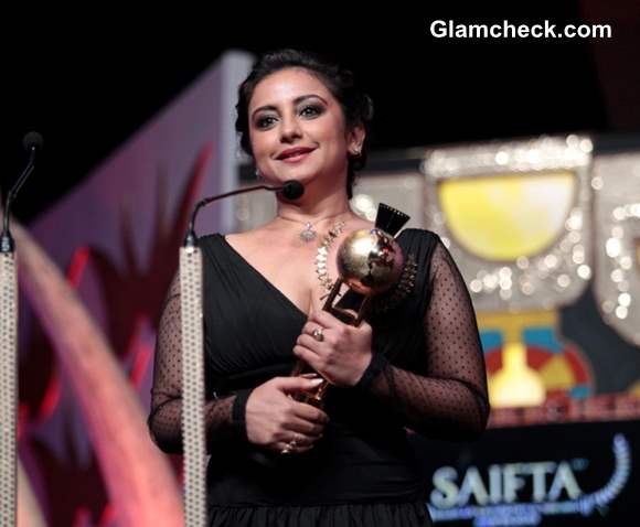 Divya Dutta receiving Best Supporting Actor at the SAIFTA award ceremony