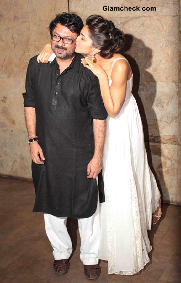 Deepika Padukone kisses filmmaker Sanjay Leela Bhansali during the screening of film Ram-Leela