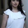 Bhagyashree Pairs a Frilly white Top with Maroon Denims