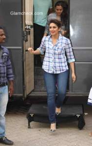 Huma Qureshi wears classic plaid shirt with blue jeans