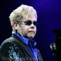 Sir Elton John files charges Unpaid Bid Charity Auction