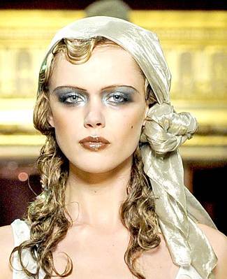 Dramatic head gears from John Galliano