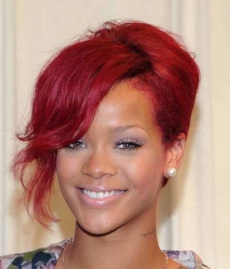 Rihanna red hair updo with side swept away bang October 2010