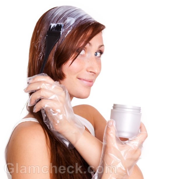 woman applying bleach hair