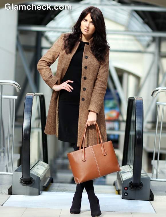 wearing black dress with camel coat winter styling tips