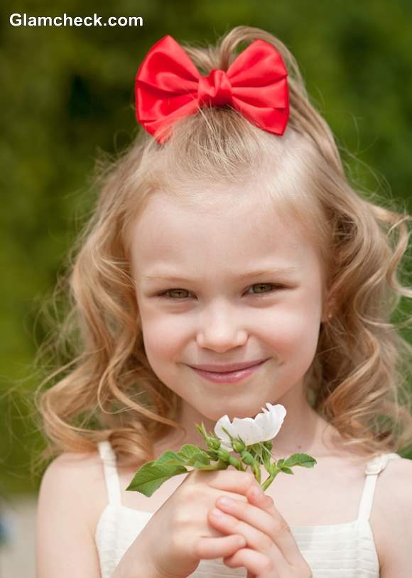 Little girls hairstyle with bow accessories