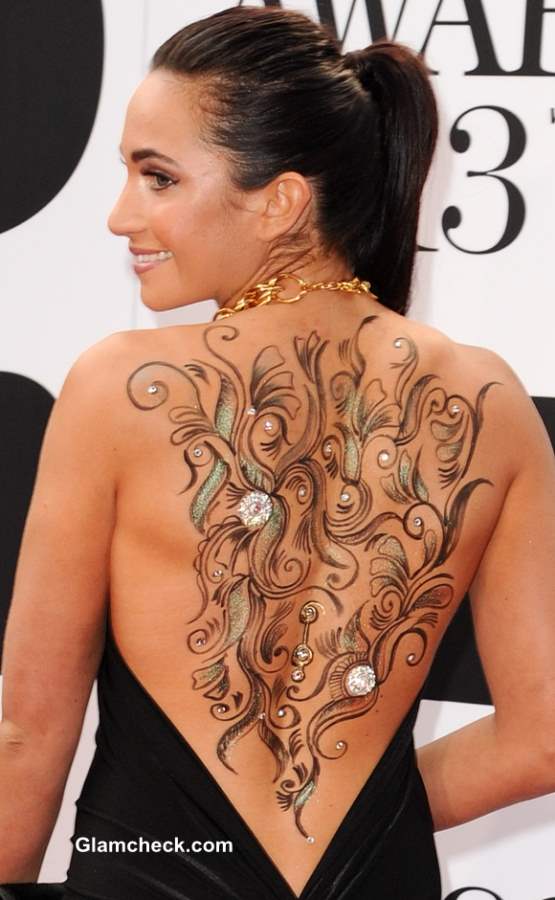 Laura Wright Shows Off Sexy Body Art in Backless Dress