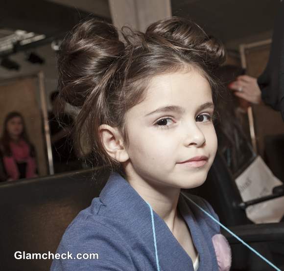 messy double bun hairstyle for little girls