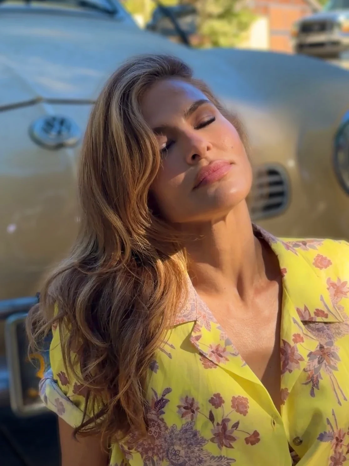 Eva Mendes in a cheerful yellow floral outfit
