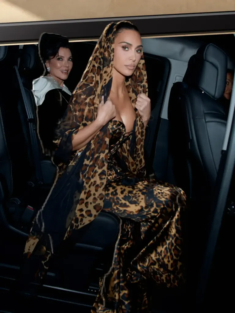 Leopard motif winding around the hips of Kim Kardashian’s lace-up couture gown