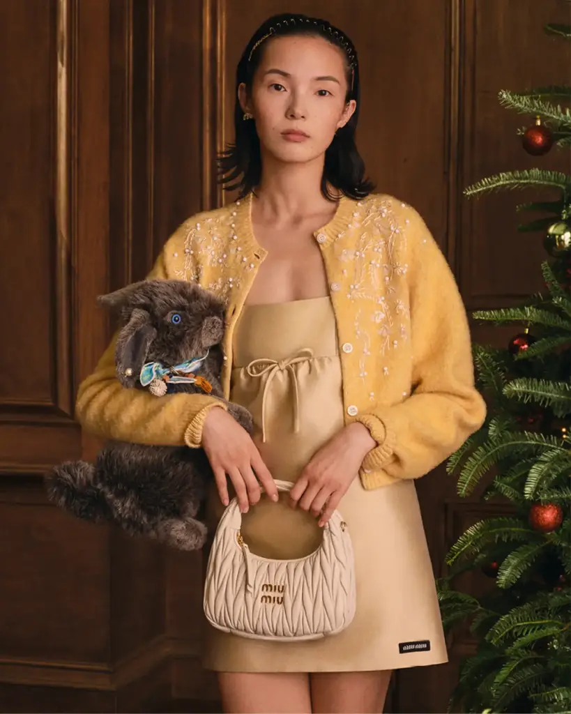 Models posing with plush rabbits, bears and geese in Miu Miu's holiday campaign