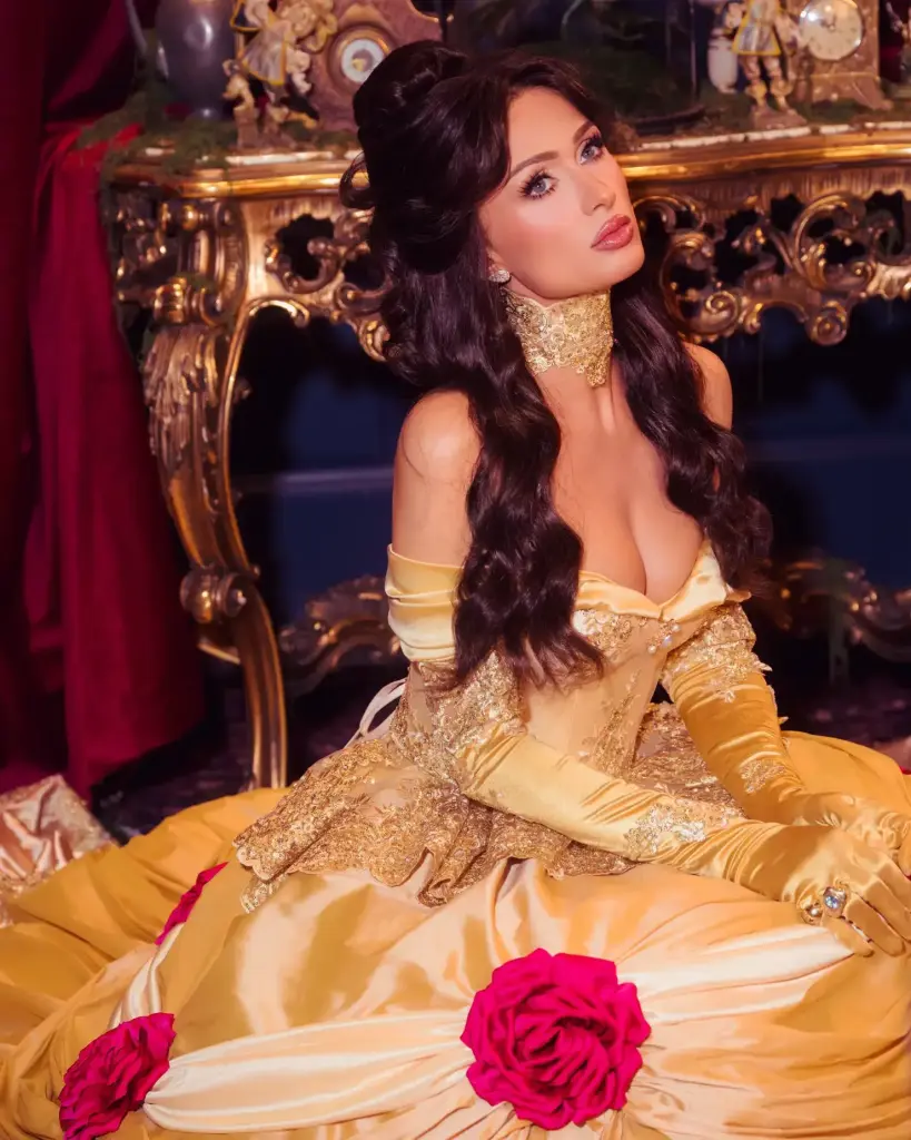 Paris Hilton wearing a brunette wig, yellow opera gloves, a lace choker and jewellery