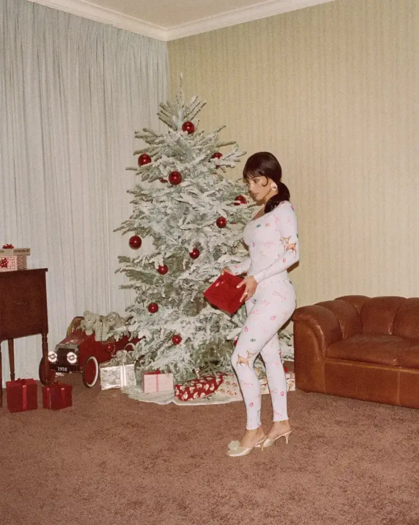 Kim Kardashian in a reindeer-print dress and Kylie Jenner in a Fair Isle bralette and miniskirt
