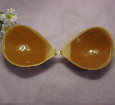A NuBra adhesive bra with two silicone cups joined by a front hook closure