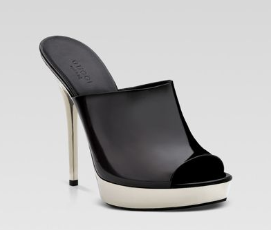 A heeled mule with a closed toe and completely open back