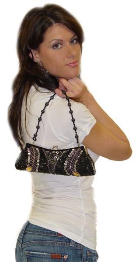 A clutch bag held close to the body