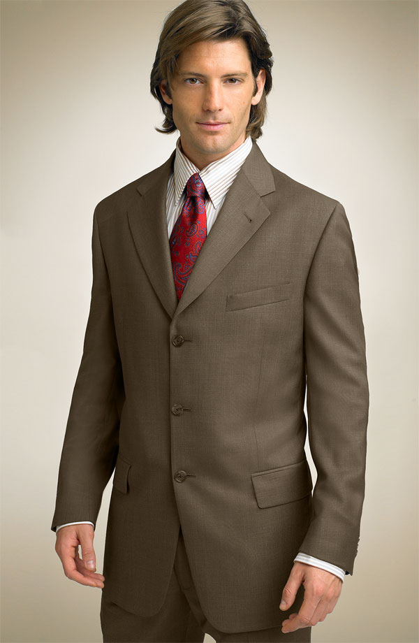 A well-tailored suit worn in a professional setting