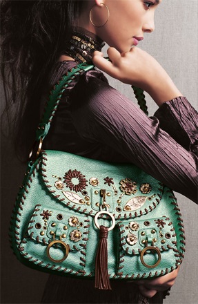 A designer handbag shown as part of an outfit