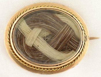 A hair art brooch made using cut work