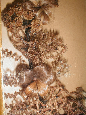 Victorian hair art in a framed decorative arrangement